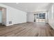 Spacious living room with hardwood floors and ample natural light at 8241 Rockvale Dr, Littleton, CO 80125