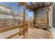 Cozy back deck with wooden pergola, lattice details and view of a fenced in yard with patio at 2339 Lowell Blvd, Denver, CO 80211