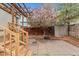 The backyard features a storage shed and patio area adjacent to a pergola and mature shade trees at 2339 Lowell Blvd, Denver, CO 80211
