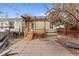 Backyard features mature landscaping, a wood deck, stone patio and access to the back of the house at 2339 Lowell Blvd, Denver, CO 80211