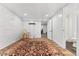 Finished basement featuring exposed brick, recessed lighting, and a doorway to an updated bathroom at 2339 Lowell Blvd, Denver, CO 80211