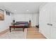The finished basement includes a seating area and painted brick walls at 2339 Lowell Blvd, Denver, CO 80211