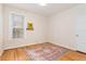 A charming bedroom with hardwood floors, a window, and a neutral color palette at 2339 Lowell Blvd, Denver, CO 80211