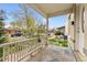 Charming covered front porch with decorative columns and a view of the tree-lined street at 2339 Lowell Blvd, Denver, CO 80211