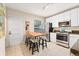 Functional kitchen featuring stainless steel appliances, ample cabinetry, and a casual dining area at 2339 Lowell Blvd, Denver, CO 80211