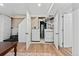 Laundry room features white washer and dryer, accessed through double doors at 2339 Lowell Blvd, Denver, CO 80211