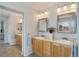 Elegant bathroom with double vanity and updated fixtures at 2202 Indian Paintbrush Way, Erie, CO 80516