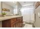 Clean bathroom with tub shower combination and wood vanity at 2715 Sunset Pl, Erie, CO 80516