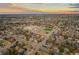 Aerial view of the neighborhood featuring a nearby school and playing fields at sunset at 6532 S Ogden St, Centennial, CO 80121