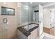 Modern bathroom featuring a soaking tub, large tiles, and a glass-enclosed shower at 6532 S Ogden St, Centennial, CO 80121