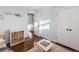 Another view of the well-lit bedroom with a large window, wood floors, and closet at 6532 S Ogden St, Centennial, CO 80121