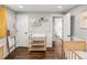 Bedroom featuring a baby changing table, wood floors, and built-in shelves for storage at 6532 S Ogden St, Centennial, CO 80121