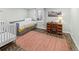 A bedroom featuring a daybed with storage, hardwood floors, and a wooden desk at 6532 S Ogden St, Centennial, CO 80121