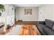 Spacious living room featuring hardwood floors, a large window, and neutral wall colors at 6532 S Ogden St, Centennial, CO 80121