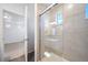 Modern bathroom with a glass shower door and updated fixtures at 16142 E 111Th Dr, Commerce City, CO 80022