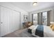 Bedroom with double door closet and window coverings at 16142 E 111Th Dr, Commerce City, CO 80022