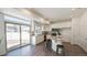 Modern kitchen with island and sliding door to backyard at 16142 E 111Th Dr, Commerce City, CO 80022