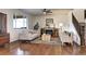 Inviting living room with hardwood floors, a fireplace, and a staircase leading to the upper level at 7353 S Queensburg St, Aurora, CO 80016