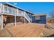 Backyard with a deck, shed, and convenient staircase leading up to the upper level at 14936 E Arizona Pl, Aurora, CO 80012