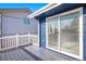 Charming deck with white railings and sliding glass doors for seamless indoor-outdoor living at 14936 E Arizona Pl, Aurora, CO 80012