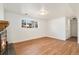Basement living room featuring hardwood floors, a fireplace, and natural light at 14936 E Arizona Pl, Aurora, CO 80012