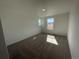 Bright bedroom featuring neutral carpeting and a window providing natural light at 22057 E 39Th Pl, Aurora, CO 80019