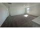 Bonus room with carpet flooring featuring a window bringing in natural light at 22057 E 39Th Pl, Aurora, CO 80019