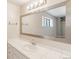 Bathroom with a large vanity mirror and tiled countertops at 70 W 6Th Ave # 109, Denver, CO 80204