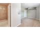 Hallway showing bathroom and doorway to room with carpet and duct work on ceiling at 70 W 6Th Ave # 109, Denver, CO 80204