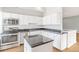 Modern kitchen with stainless steel appliances and granite countertops at 70 W 6Th Ave # 109, Denver, CO 80204