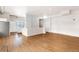 Spacious, open floor plan with hardwood floors connects the kitchen and living areas seamlessly at 70 W 6Th Ave # 109, Denver, CO 80204