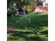 Expansive backyard with lush green lawn and mature trees at 995 W Peakview Cir, Littleton, CO 80120