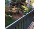 Balcony showcases scenic view of the tree-filled backyard at 995 W Peakview Cir, Littleton, CO 80120