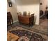 Basement dining area with vintage table, chairs, and view into bedroom at 995 W Peakview Cir, Littleton, CO 80120