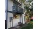 Exterior of home with a balcony, swing, and green grass at 995 W Peakview Cir, Littleton, CO 80120