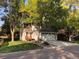 Charming single-Gathering home with a well-manicured lawn, mature trees, and an attached two-car garage at 995 W Peakview Cir, Littleton, CO 80120