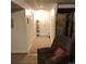 Hallway with carpeted floors, storage closet, and access to other rooms at 995 W Peakview Cir, Littleton, CO 80120