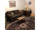 Basement living room with comfortable seating and a decorative area rug at 995 W Peakview Cir, Littleton, CO 80120