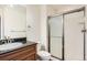 The bathroom has a granite counter top, single sink, and tiled stand up shower at 9139 W 50Th Ln # 204, Arvada, CO 80002