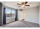 Bright bedroom featuring a large window with views and neutral colored carpet at 9139 W 50Th Ln # 204, Arvada, CO 80002
