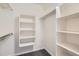 Walk-in closet with built-in white shelving for organization and storage of personal items at 9139 W 50Th Ln # 204, Arvada, CO 80002