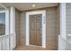Close-up of the front door, featuring the house number and a secure lock system at 9139 W 50Th Ln # 204, Arvada, CO 80002