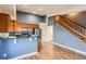 Eat-in kitchen area showcasing stainless appliances, bar seating, and an open floor plan at 9139 W 50Th Ln # 204, Arvada, CO 80002