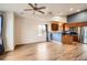 Open floor plan with modern kitchen, stainless appliances, and wood-look floors at 9139 W 50Th Ln # 204, Arvada, CO 80002