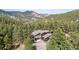 Aerial view capturing the property surrounded by towering trees, creating a private and serene atmosphere at 37 Wagner Cir, Boulder, CO 80304