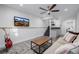 Cozy finished basement with wet bar, a guitar, and mounted TV at 37 Wagner Cir, Boulder, CO 80304