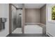 Beautiful bathroom with a separate shower and bathtub with stone detailing at 37 Wagner Cir, Boulder, CO 80304