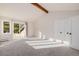 Bright and airy bedroom with vaulted ceiling, large windows, and a spacious closet at 37 Wagner Cir, Boulder, CO 80304