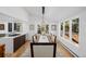Beautiful dining room with large windows and a modern light fixture at 37 Wagner Cir, Boulder, CO 80304