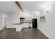 Modern kitchen featuring white cabinets, sleek appliances, and a wood beam at 37 Wagner Cir, Boulder, CO 80304